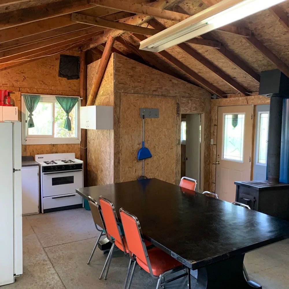 View of the rustic kitchen and dining area in cottage 5.