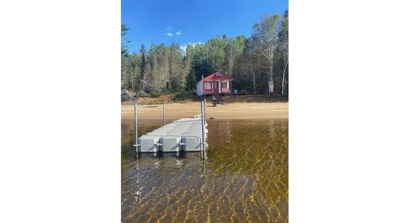 View of cabin number twelve from the floating dock located at the edge of the beach.