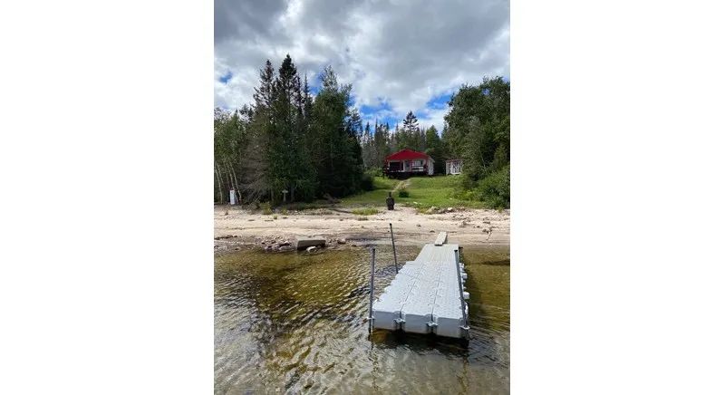 View of the cottage from the dock by the lake.