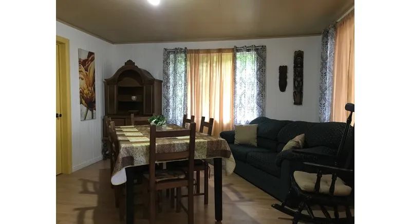 The dining area and living room of cottage 16 offer a cozy living space.