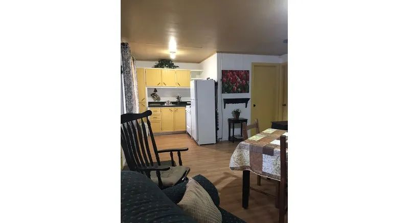 View of the kitchen area and dining room in cottage 16.