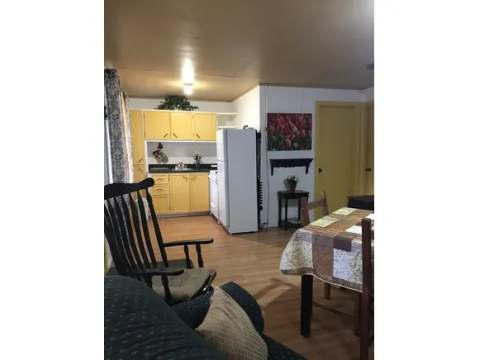 View of the kitchen area and dining room in cottage 16.