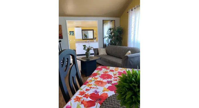 Open living area including a comfortable lounge and dining space in the cabin.