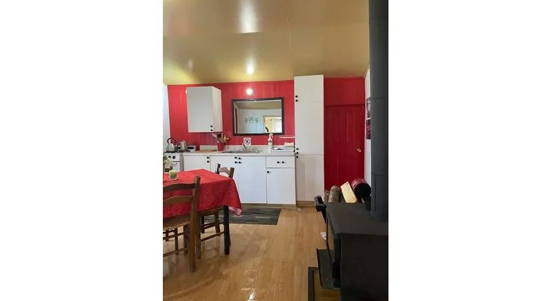 The equipped kitchen and dining area are set up in the open-plan space of the cabin.