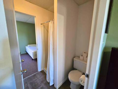 View of the functional bathroom with shower adjacent to the Studio L'Ours bedroom.