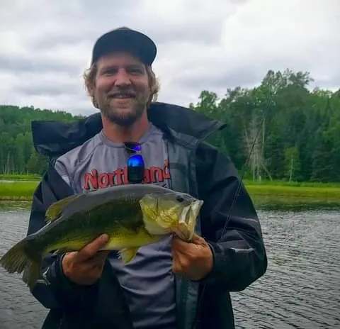Catching a bass at Pourvoirie Michel St-Louis, Laurentides, Quebec