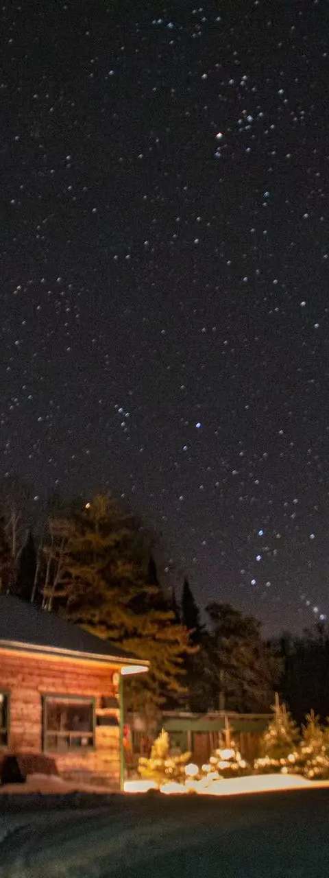 Starry sky and Milky Way above the outfitter at Pourvoirie Pignon Rouge Mokocan, Lanaudière, Quebec