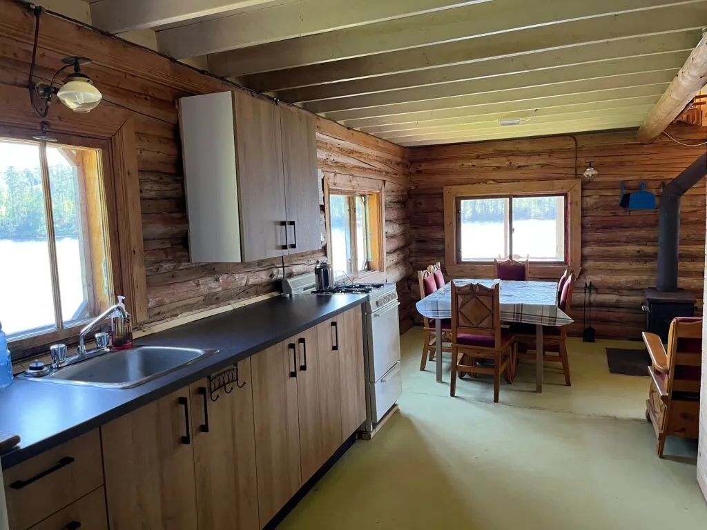 The functional kitchen and dining area of the Jolie Chalet.
