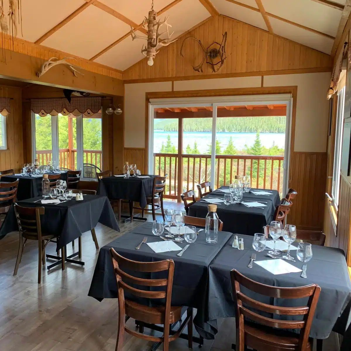 The inn's dining room offers a panoramic view of the lake and the surrounding forest.