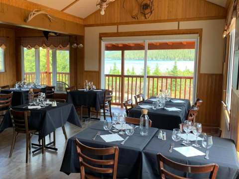 The inn's dining room offers a panoramic view of the lake and the surrounding forest.