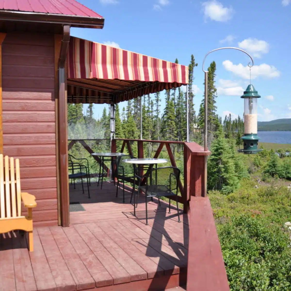 Enjoy the forest view from the furnished deck of our inn.