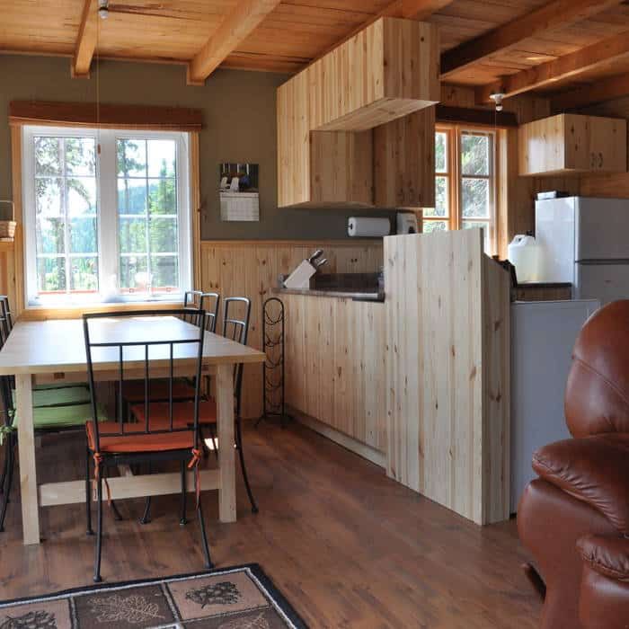 Kitchenette and dining area with wooden counter in the Point 4 cabin.
