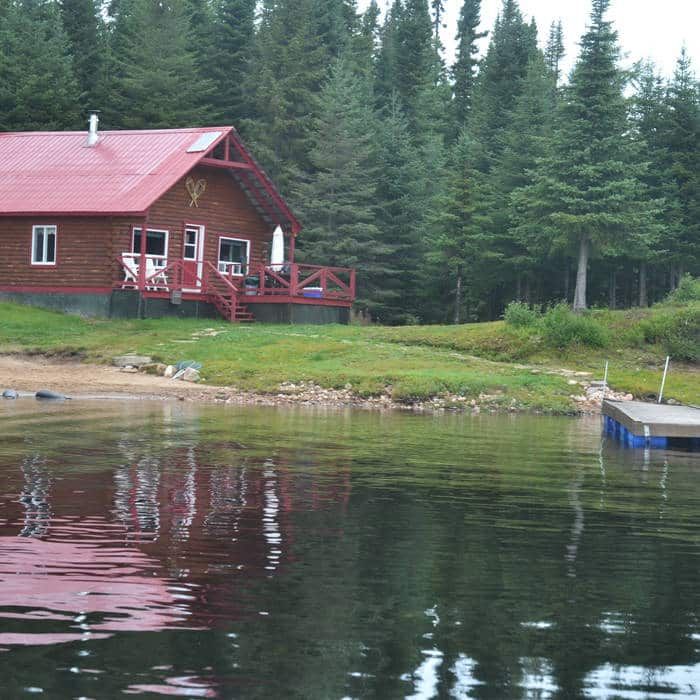 The Point 7 cottage is located by the water with its private dock and wooden deck.