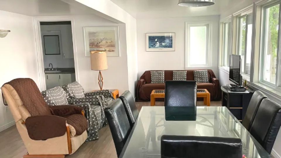 View of the open concept living and dining area in the Le Branchu cottage.