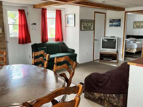View of the Le Garrot cottage living and dining area with its comfortable furniture.