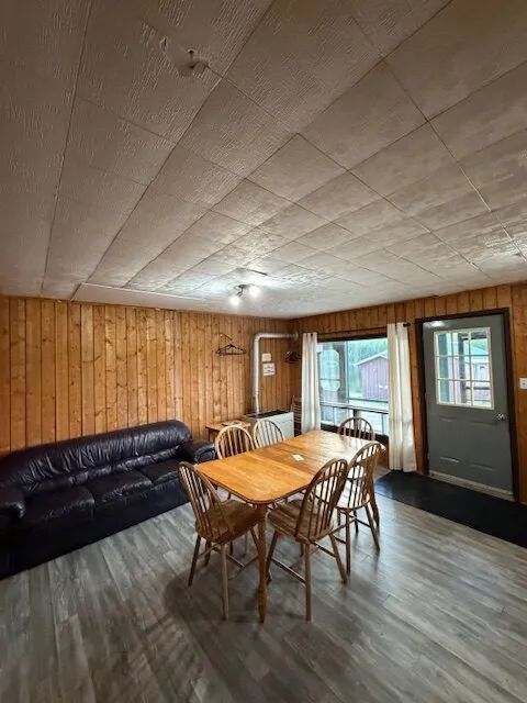 Main living area featuring a dining table and sofa in cabin 4.
