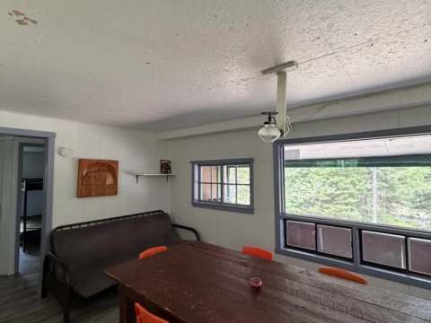 View of the dining area and living space in chalet number 6.