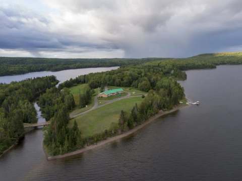 Aerial view of Auberge 24 arpents situated on a point surrounded by water.