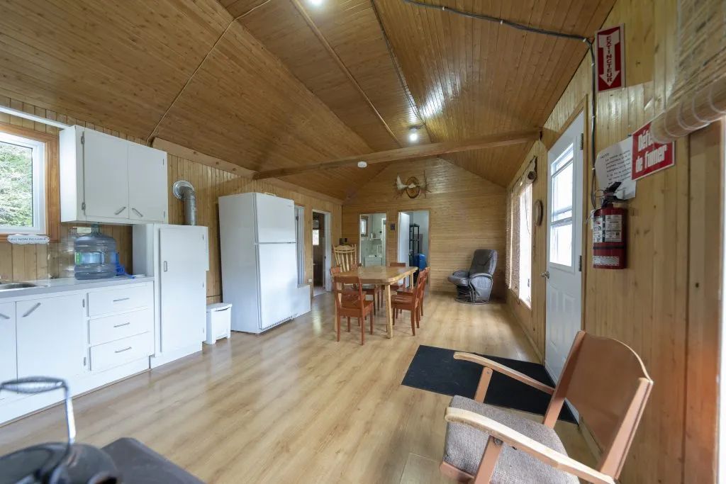 Overview of the open area including the kitchen, dining room, and lounge area of the cottage.
