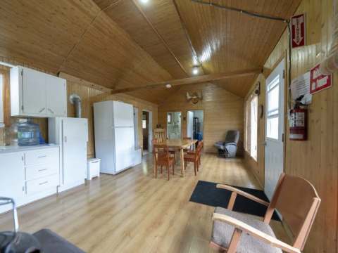 Overview of the main living area featuring a kitchen, dining room, and living area.