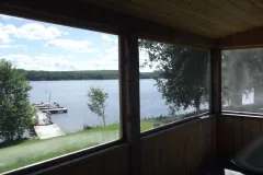 View of the lake and dock from the chalet's screened porch.