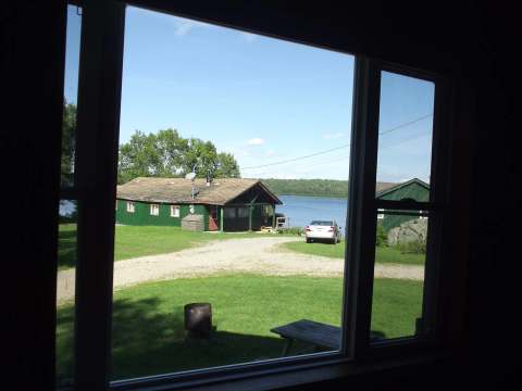 View of the outfitter grounds and cabins from a window.