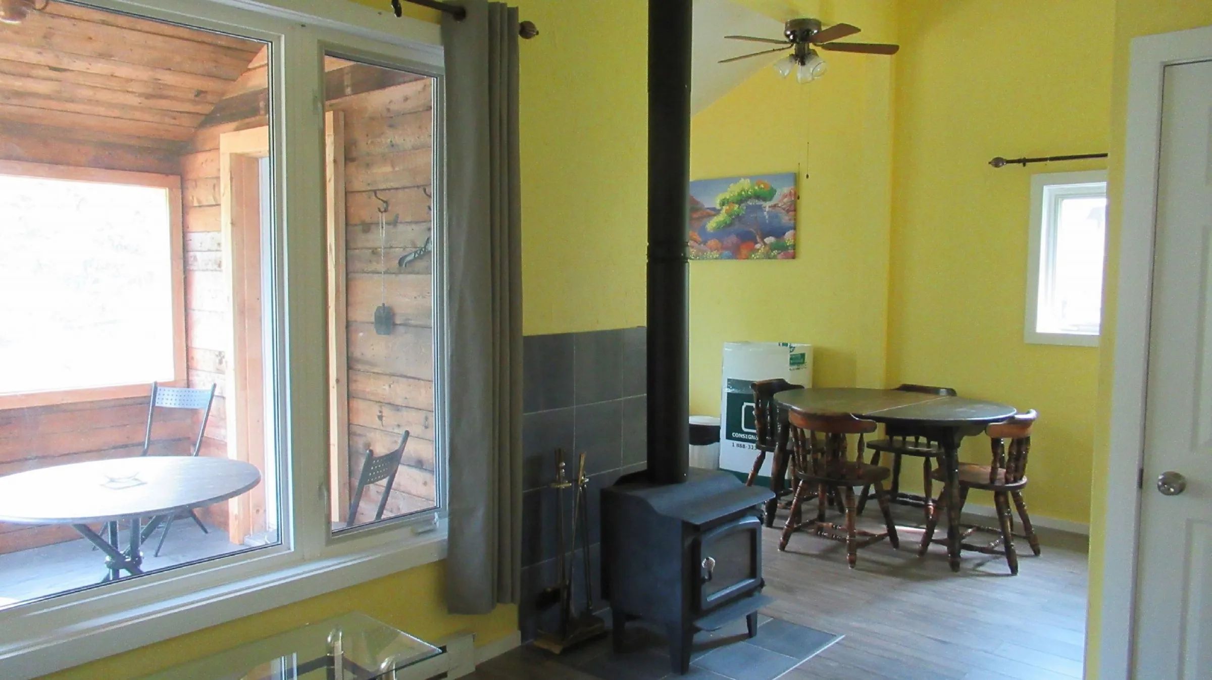 Dining area and wood stove in the cabin's living space.