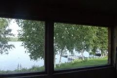 View of the lake and docks from inside the cottage.
