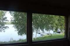View of the lake and docks from inside the cottage.