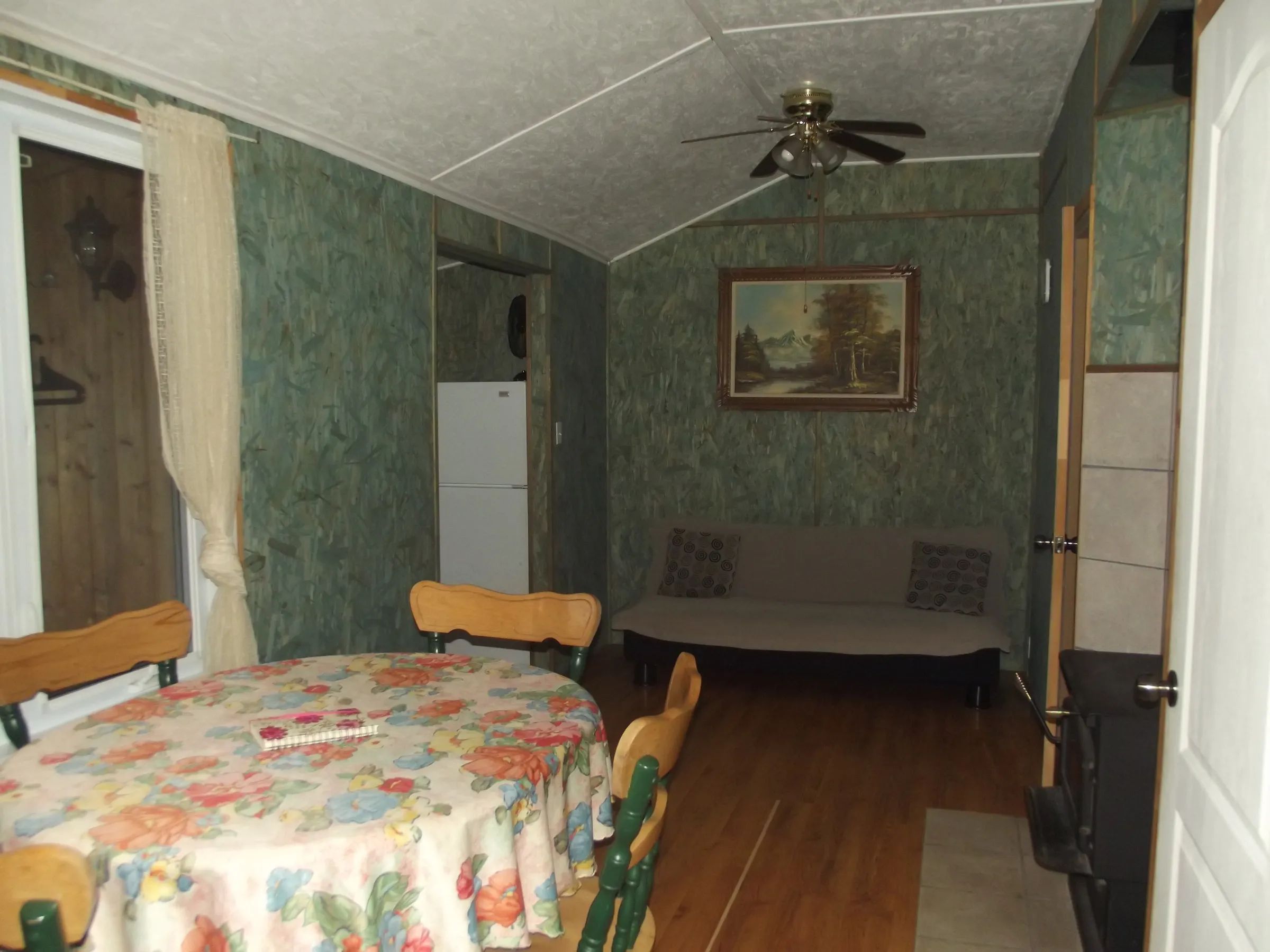 View of the dining area and living space in cabin 7.