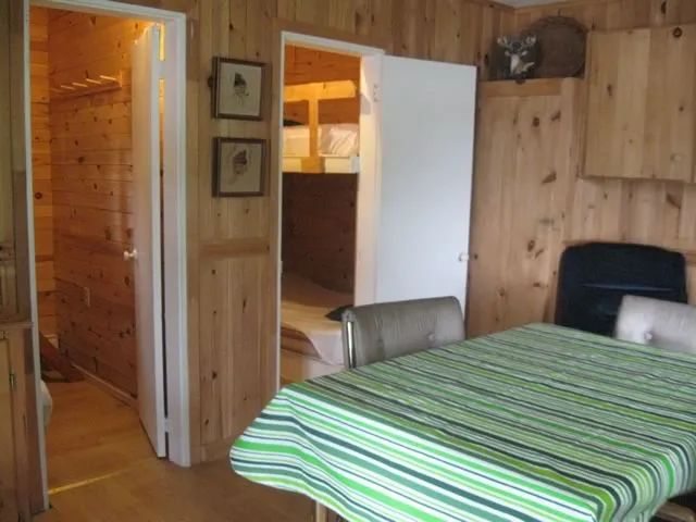 Interior view of chalet 2 with dining area and access to the bedrooms.