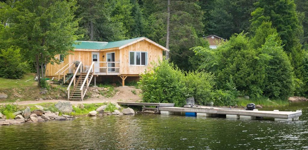 Chalet 6 is located by the lake with direct access to a private dock.