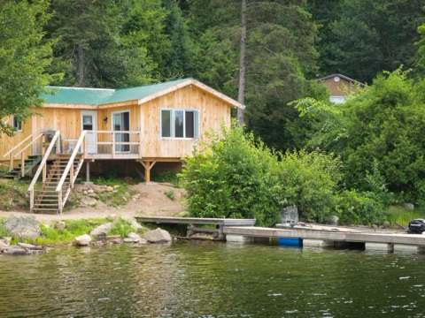 Chalet 6 is located by the lake with direct access to a private dock.