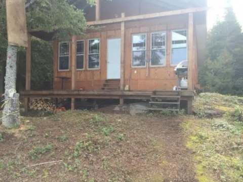 Exterior view of the Bapati cabin with its large wooden deck.