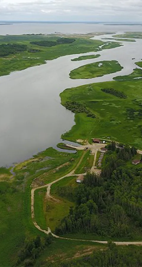 Aerial view of the estate and the Waterhen River. at Harvest Lodge, Parkland, Manitoba