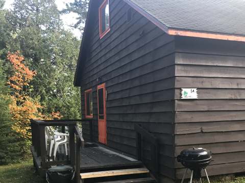 Side view of cabin 1a with its private deck and outdoor barbecue.