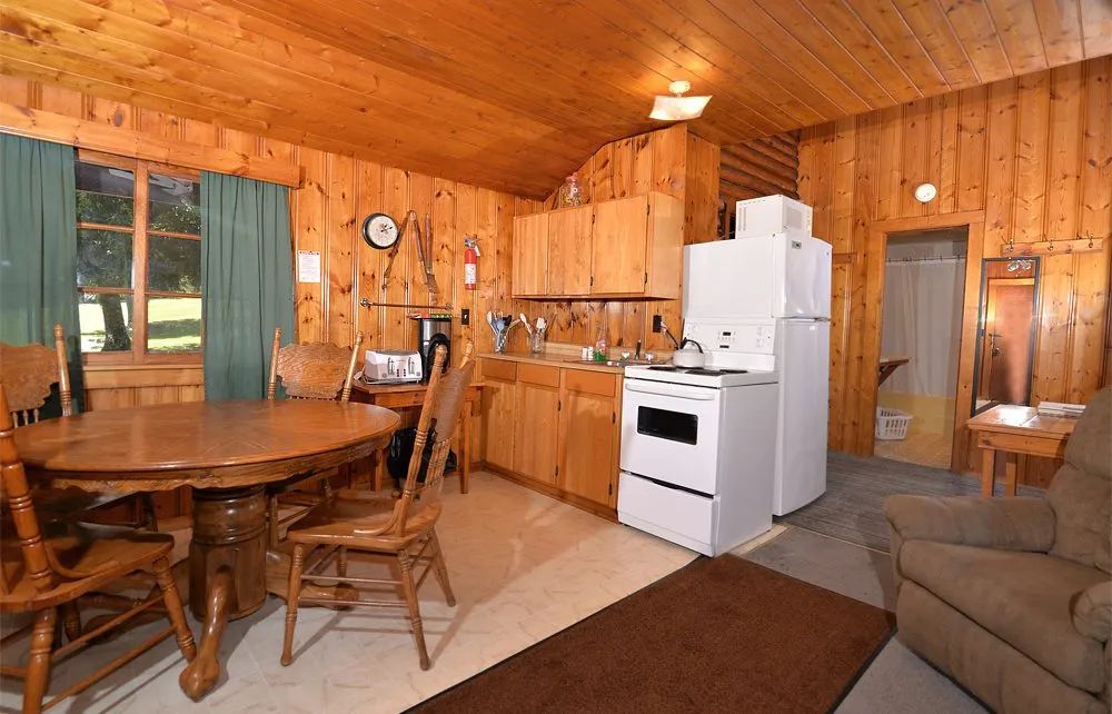 The kitchen and wooden dining area of the cabin.