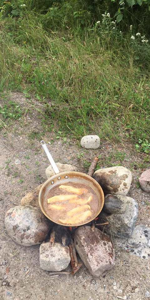 Preparing a fresh fish shore lunch at Manotak Lodge, Sunset Country, Ontario