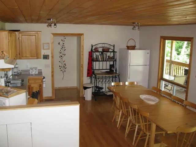 The functional kitchen and spacious dining area of the seven-bedroom cabin.