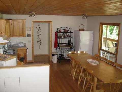 The functional kitchen and spacious dining area of the seven-bedroom cabin.