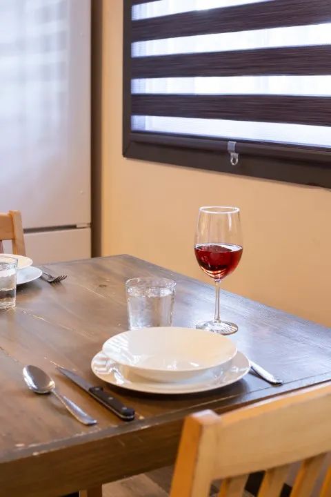 The dining table is set in the suite for your meals.