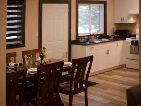 The family suite features a kitchen and dining area set up for your meals.
