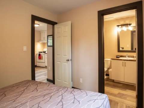 View of the bathroom and kitchen from the family suite bedroom.
