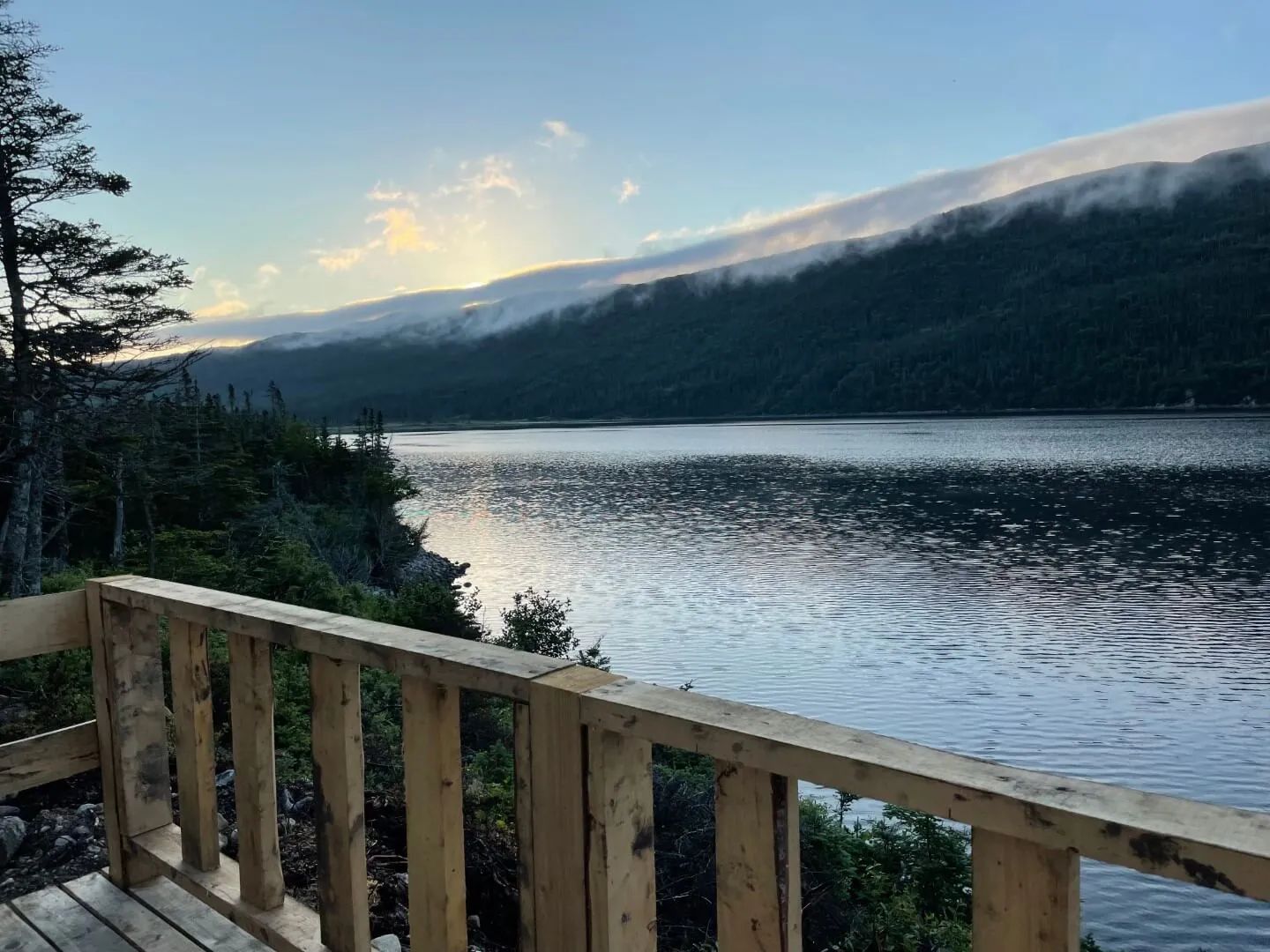 Enjoy a peaceful view of the bay from the cabin's wooden deck.