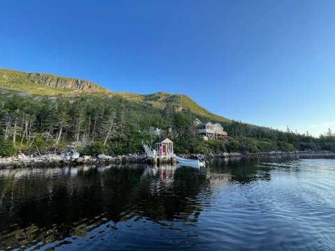 View of the cabin and private dock from the water.