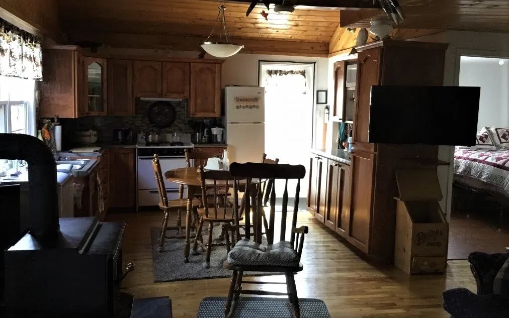 The functional kitchen and open dining area of the cabin.