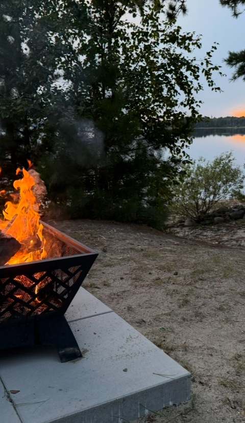 Outdoor fire pit in the evening at Camps Lac-aux-Sables, Abitibi-Témiscamingue, Quebec