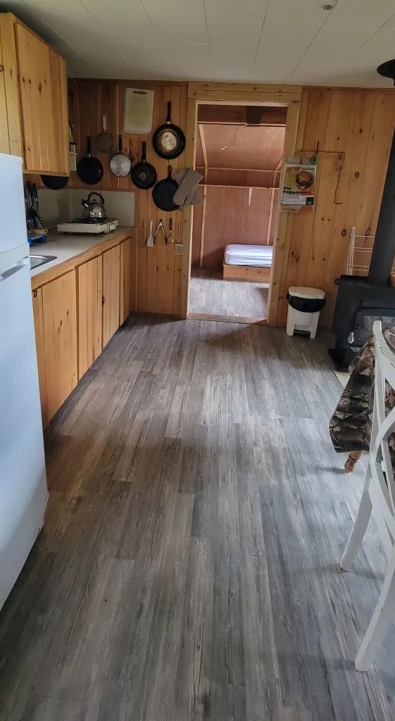 View of the functional kitchen and living area in the Ducharme cottage.