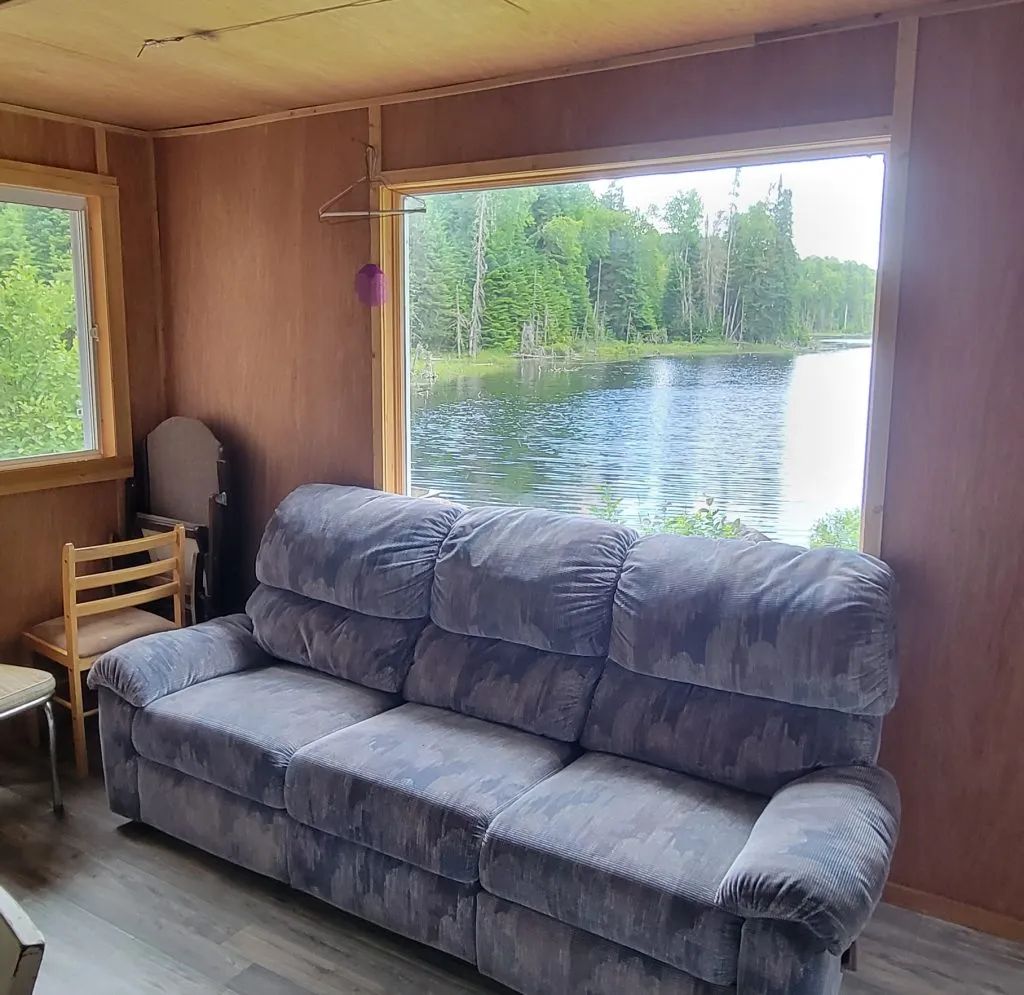 Living area with a lake view from Chalet Ducharme.