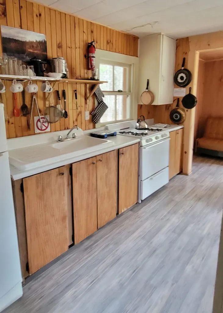 The functional kitchen of the Troll chalet includes a stove and a convenient sink.
